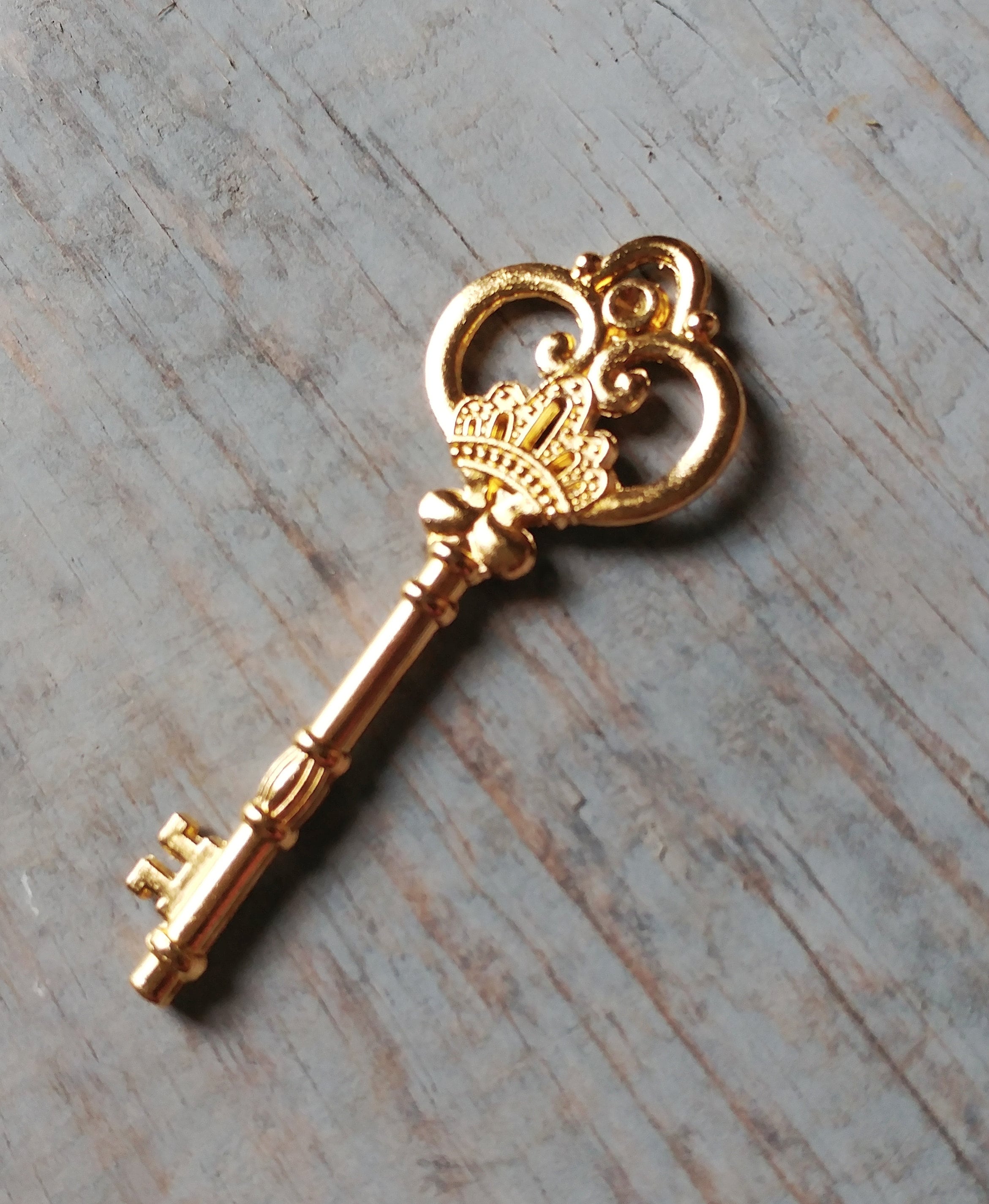 two crossed gold-colored antique keys' Sticker