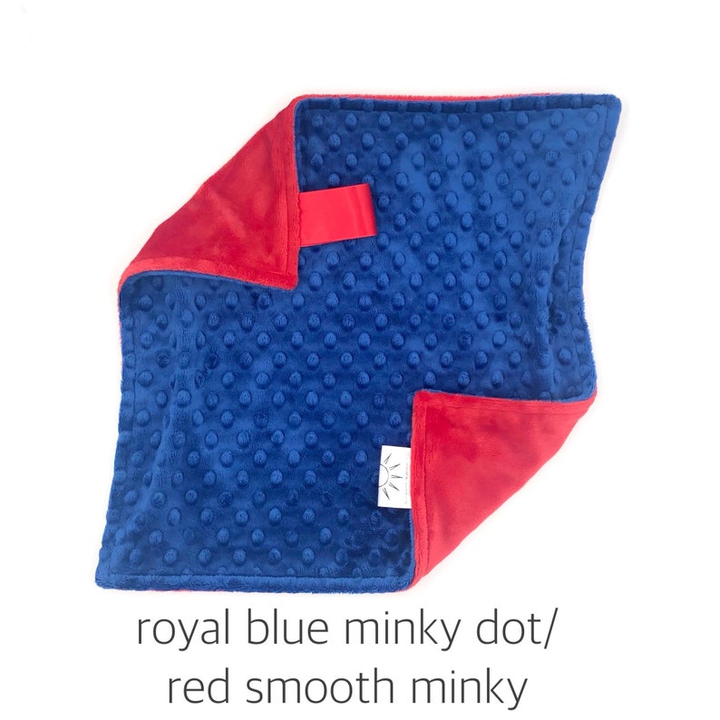 May include: A soft, blue minky dot baby blanket with a red smooth minky backing. The blanket is folded in half, showing both sides.