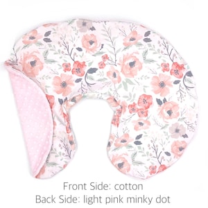 May include: A U-shaped nursing pillow with a floral print on the front and a light pink minky dot fabric on the back.  Front Side: cotton. Back Side: light pink minky dot.
