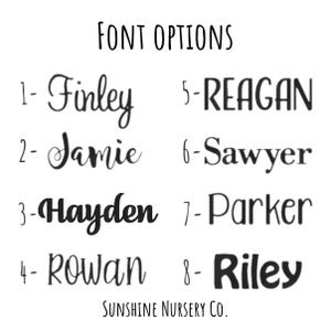 May include: A black and white font options chart titled FONT OPTIONS with the text Sunshine Nursery Co. at the bottom. It lists eight numbered styles featuring the names Finley, Jamie, Hayden, Rowan, REAGAN, Sawyer, Parker, and Riley.