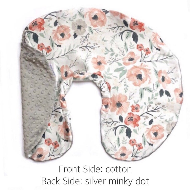 May include: A U-shaped nursing pillow with a floral print on one side and a gray minky dot fabric on the other side.  Front Side: cotton Back Side: silver minky dot