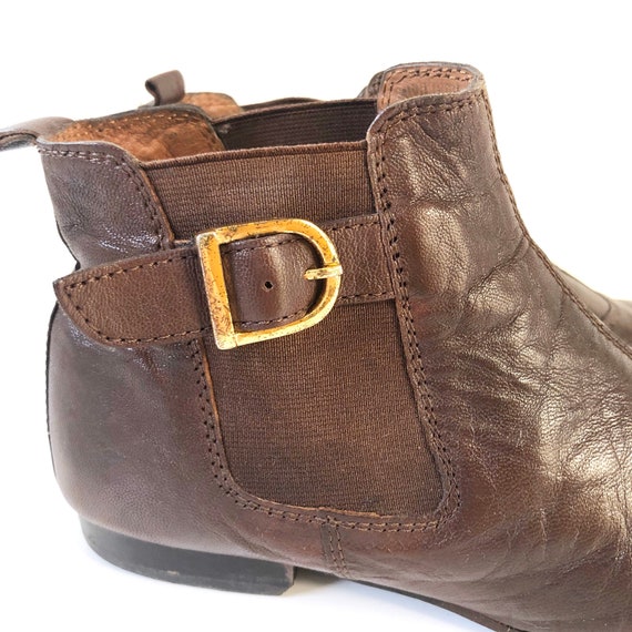 Ankle boots with gold buckles discount
