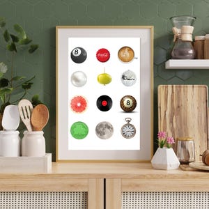 May include: A framed print featuring a collection of colorful circular images. The images include a black 8-ball, a Coca-Cola bottle cap, a cup of coffee, a pearl, a lime, a disco ball, a grapefruit slice, a vinyl record, a leopard-print 8-ball, a shamrock, a moon, and a pocket watch.
