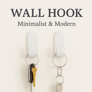 May include: Two white wall hooks with silver key rings. One hook holds keys with a gold key and black key fob. The other hook holds a silver key ring with multiple silver rings and a silver tag. Text reads "WALL HOOK Minimalist & Modern."