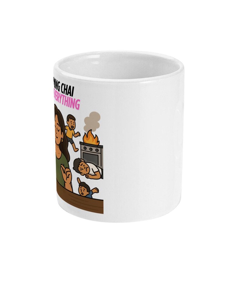 May include: White ceramic mug with a cartoon illustration. The mug features a woman with children and text that reads "Making Chai Fixes Everything". The illustration depicts a kitchen scene with a stove on fire.