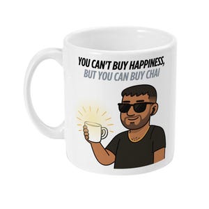 May include: White ceramic mug with a black handle featuring a cartoon illustration of a man wearing sunglasses and holding a cup. The mug has the text "YOU CAN'T BUY HAPPINESS, BUT YOU CAN BUY CHAI".