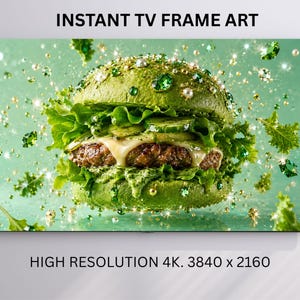 May include: A digital display showing INSTANT TV FRAME ART with a high-resolution 4K 3840 x 2160 image of a green burger topped with lettuce, pickles, and melted cheese, surrounded by floating green crystals and pearls on a light green background.
