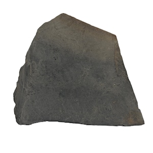 May include: A dark gray, irregularly shaped stone with a rough, matte texture. The object features sharp, angular edges and a flat base, displaying a natural, weathered surface with subtle variations in tone across its solid, dense appearance.