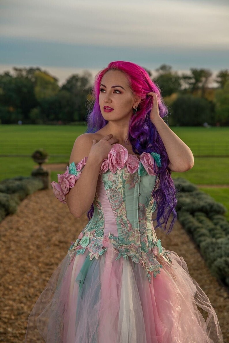 Whimsical pastel goth colourful rainbow wedding dress alternative corset lace pink green flowers