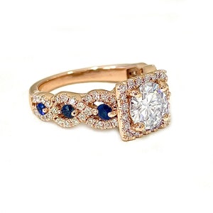 Round Cut Moissanite And Sapphire Halo Style Engagement Ring Set In 14K Solid Rose Gold Bridal Wedding Ring Braided Design Ring 2.00ctw