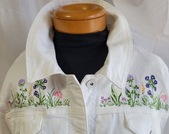 White jean jacket, ladies size xxl embellished with machine embroidered flower borders and handwoven fringe, one-of-a-kind art