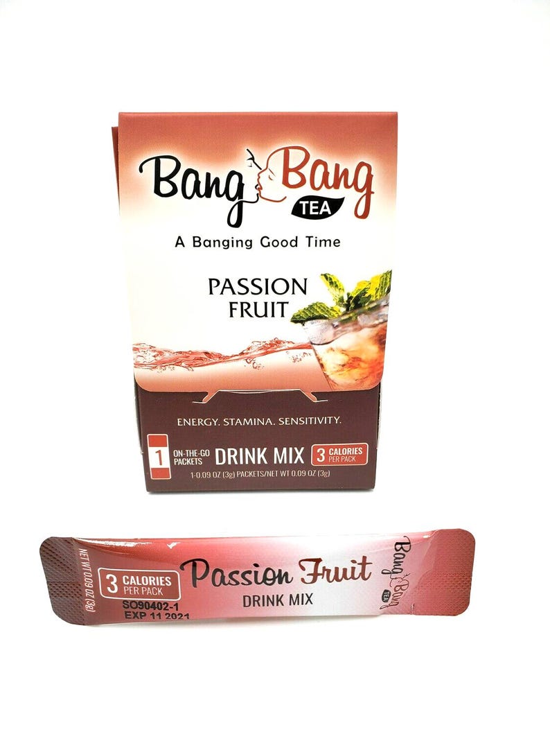 May include: A box of Bang Bang Tea Passion Fruit drink mix with a single serving packet. The box is red and white with a picture of a glass of iced tea. The packet is red and white with the text "Passion Fruit Drink Mix" and "Bang Bang" printed on it.