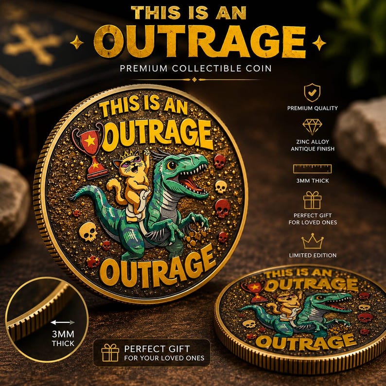May include: A round collectible coin with an antique finish featuring a green dinosaur ridden by a cat wearing a crown. The text reads THIS IS AN OUTRAGE. The coin has a textured black background with small skulls and a trophy. It is 3mm thick.