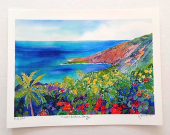 May include: Watercolor painting of Kealakekua Bay, featuring a vibrant coastal landscape. The artwork showcases a deep blue ocean, lush green hills, and colorful flowers in red, yellow, and blue. The print is numbered 83/500.