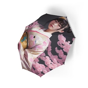 A charming umbrella depicting a woman in a traditional Japanese kimono, an elegant semi-automatic folding umbrella perfect for rainy days