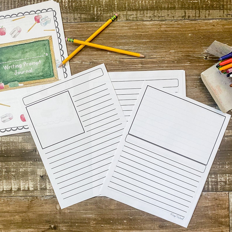 May include: A writing prompt journal with lined pages and a blank space for illustrations. Two yellow pencils and a journal cover with the text "Writing Prompt Journal" are also visible. The journal is designed for creative writing and journaling.