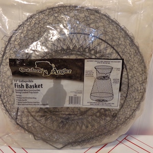 May include: A 13-inch collapsible fish basket made of black anodized wire with spring-loaded trap doors. The product is sealed in a clear plastic bag with a label featuring the text Outdoor Angler, 13 inch Collapsible Fish Basket, and features.