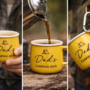 May include: Yellow camping mug with a white rim, featuring the text "Dads Camping Mug" in black script. A tent graphic is above the text. The mug is shown being filled with coffee and held by a person.