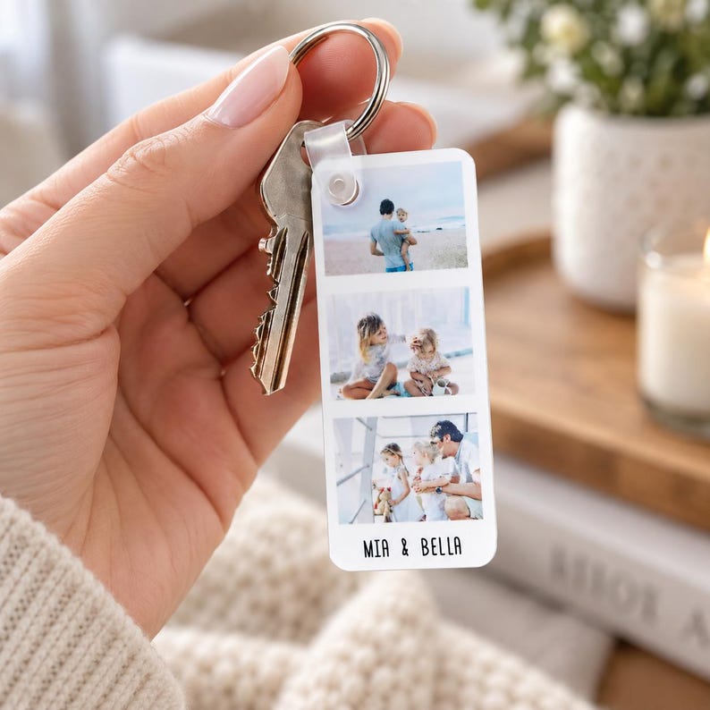 Close-up of a personalised photo strip keyring with three custom photos, personalised text and silver keyring attachment.