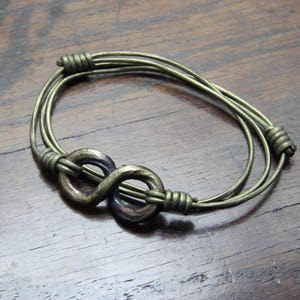 Hand Forged Pure Iron Infinity Wrap Bracelet, also wearable as a necklace.