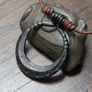 Hand Forged Pure Iron Moon Pendant on an adjustable leather necklace.