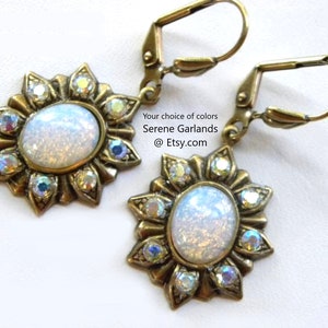 These earrings feature vintage Harlequin fire opal glass with sunflower settings accented with tiny genuine Swarovski Aurora Borealis crystals applied one at a time, by me, by hand. Very sparkly and vibrant! Available in your choice of several colors