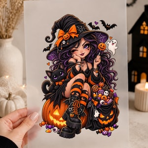 May include: A rectangular print featuring a cartoon witch with long purple hair, wearing a black hat with an orange bow, sitting on a glowing jack-o'-lantern. A black cat, a bag of colourful Halloween candy, and a small white ghost are also depicted.