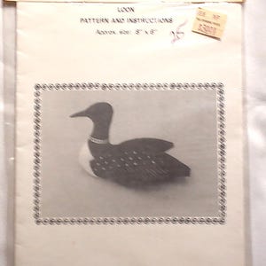 May include: A white paper packet labeled MINNESOTA COLLECTIBLES containing a LOON PATTERN AND INSTRUCTIONS. The front features a black and white image of a loon bird and states an approximate size of 8 inches by 6 inches with copyright text.