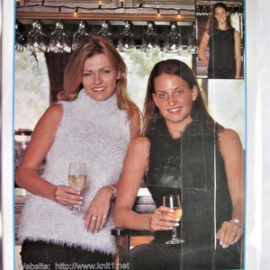 May include: Two women wearing sleeveless knit tops, one white and one black, pose in a bar setting. The image includes the text "elle LUSSURIA" and "SIZES: 87 - 102 cm HANDKNIT".