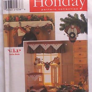 May include: Simplicity Holiday pattern collection. The image shows a pattern for making Christmas-themed home decor, including window valances and garland. The pattern features illustrations of festive designs and the text "Holiday" in red.