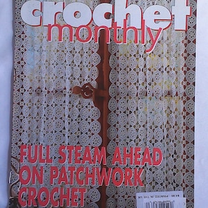 May include: A magazine cover with the title "crochet monthly" in white letters with a red outline. The cover features the text "FULL STEAM AHEAD ON PATCHWORK CROCHET" in red. The background shows a white lace curtain.