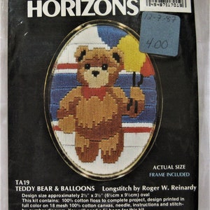 May include: A cross-stitch kit featuring a teddy bear holding balloons. The kit includes 100% cotton floss, a needle, instructions, and a stitch-by-number diagram. The design size is approximately 2 1/2 inches by 3 1/2 inches. The kit is made in America.