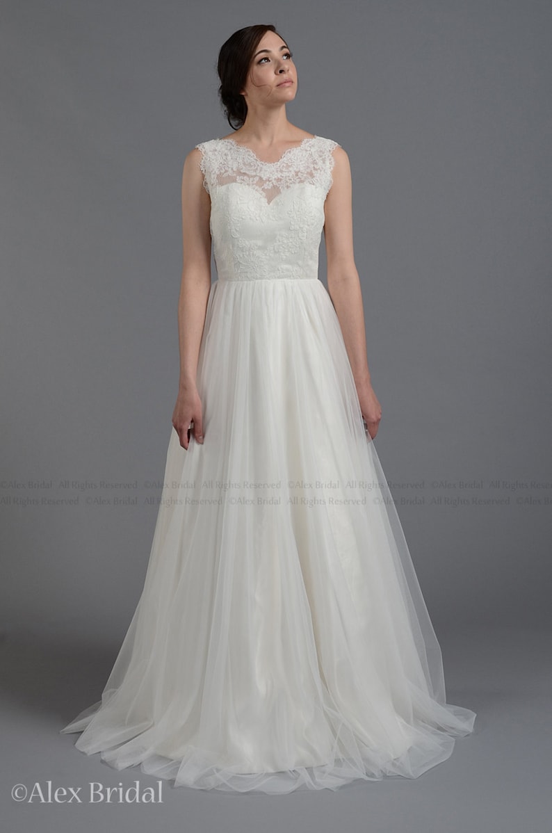 Sleeveless lace wedding dress V-back alencon lace with tulle skirt.