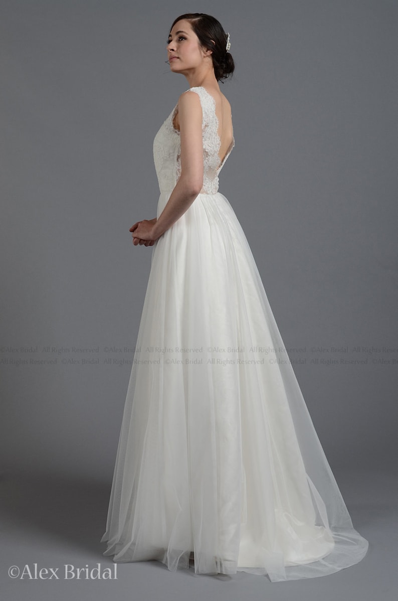 Sleeveless lace wedding dress V-back alencon lace with tulle skirt.