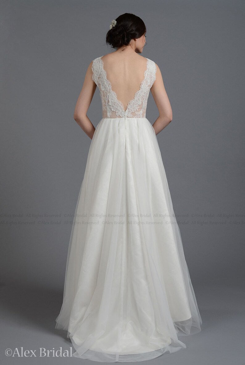 Sleeveless lace wedding dress V-back alencon lace with tulle skirt.