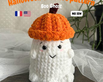 May include: A handmade crochet ghost wearing an orange pumpkin hat. The white ghost has a smiling face with rosy cheeks. The text "Halloween crochet pattern" and "Boo Ghost" are visible.