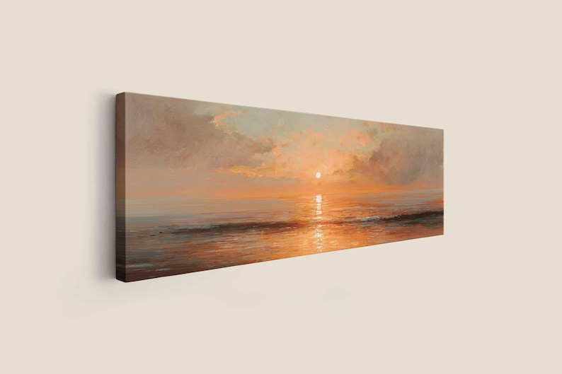 May include: A panoramic canvas print featuring an oil painting of a sunset over the ocean. The scene displays a bright sun low on the horizon, casting warm orange and golden light across the water and reflecting on the gentle waves below.
