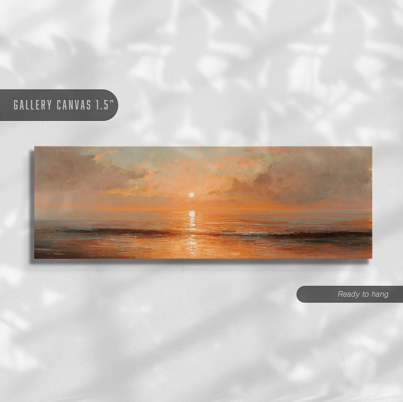 May include: A panoramic gallery canvas 1.5" print featuring an oil painting of a sunset over the ocean. The scene displays a bright sun centered above a calm sea with orange and gold reflections, surrounded by soft, muted clouds in the sky.