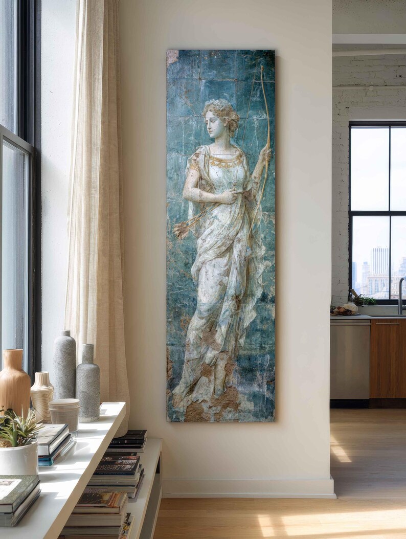 May include: A tall, rectangular wall art piece featuring a classical figure in a white, draped garment holding a bow and arrows. The artwork has a distressed, weathered appearance with a blue-green background and visible grid-like tile patterns.