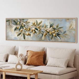 May include: A panoramic rectangular wall art piece featuring a detailed painting of an olive branch laden with green olives. The branch extends horizontally across a soft, muted blue and cream background, framed in a light-toned wooden border.