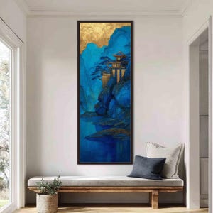 May include: A vertical rectangular wall art piece featuring a landscape painting with deep blue mountains, a calm body of water, and a golden sky. A multi-tiered structure sits on a rocky cliffside, accented with gold leaf details and dark blue trees.