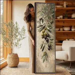 May include: A tall, rectangular framed wall art piece featuring a detailed botanical illustration of olive branches with green and dark purple olives hanging downward against a textured, neutral-toned, weathered-looking background.