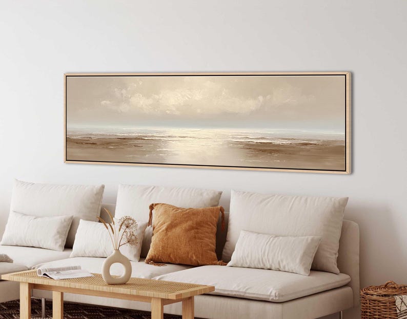 Soft neutral seascape wall art featuring a calm ocean horizon in minimalist coastal style.