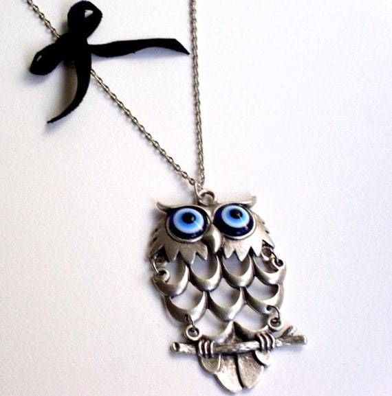 Evil eyed owl necklace Specially designed owl on a twig pendant. Adorned with silver plated chain an