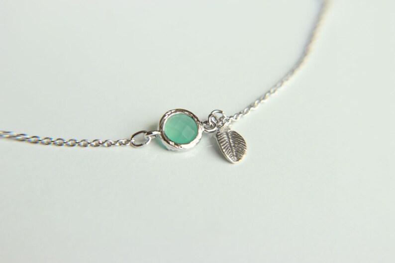 Leaf Bracelet: Rhodium plated leaf charm bracelet with ice blue faceted crystal, a perfect gift for her with minimalist style image 2