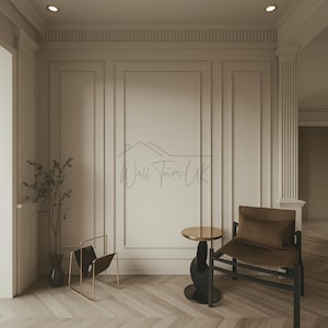 May include: A stylish interior with cream-coloured wall panelling. A modern chair with a brown cushion and a small side table with a gold top are featured. A gold and black magazine rack and a vase with a plant are also visible.