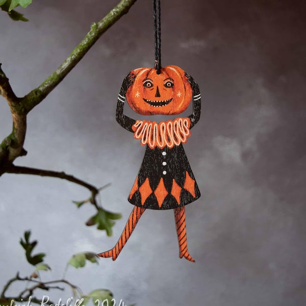 Retro style Halloween ornament of a headless pumpkin clown. Made from printed laser cut wood. Original design by Kayleigh Radcliffe