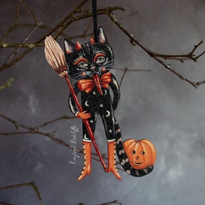 木で作られた悪魔猫のハロウィーン吊り下げ飾り。黒猫のダミアン