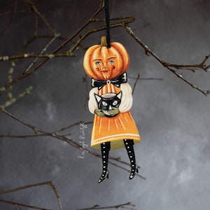 ピーターパンプキンの両面ハロウィンオーナメント。吊り下げ装飾