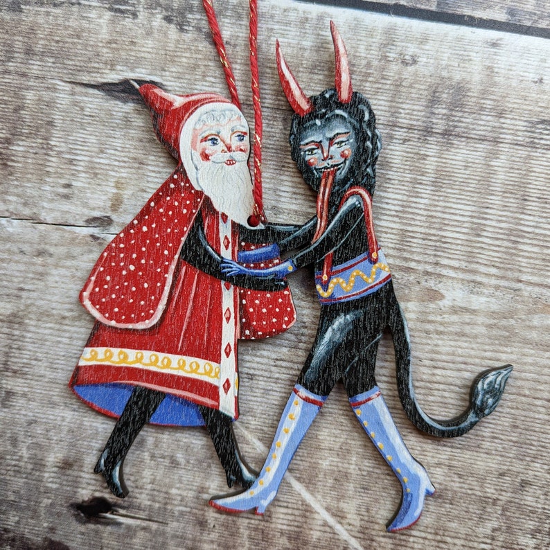 Wooden hanging Christmas ornament featuring Saint Nick dancing with the Christmas Krampus image 7